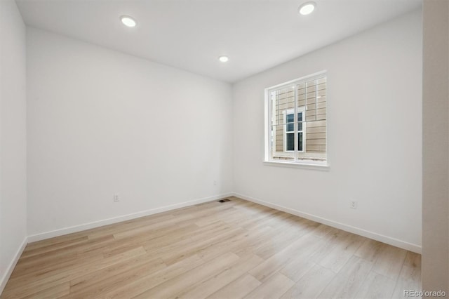 24768 E 40th Ave, Aurora, CO 80019 - empty room featuring light wood-style flooring, baseboards, and recessed lighting