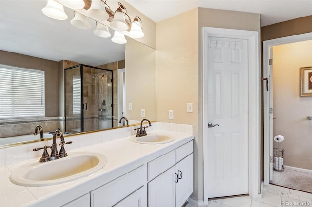 full bath featuring a shower stall, double vanity, and tile patterned flooring