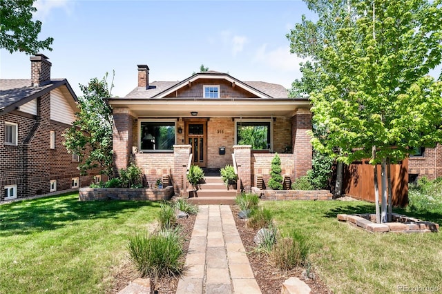315 S Franklin St, Denver, CO 80209 - view of front facade featuring a porch and brick siding