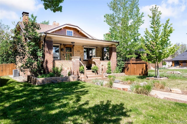 315 S Franklin St, Denver, CO 80209 - craftsman-style house with covered porch, a chimney, brick siding, stairs, and central AC