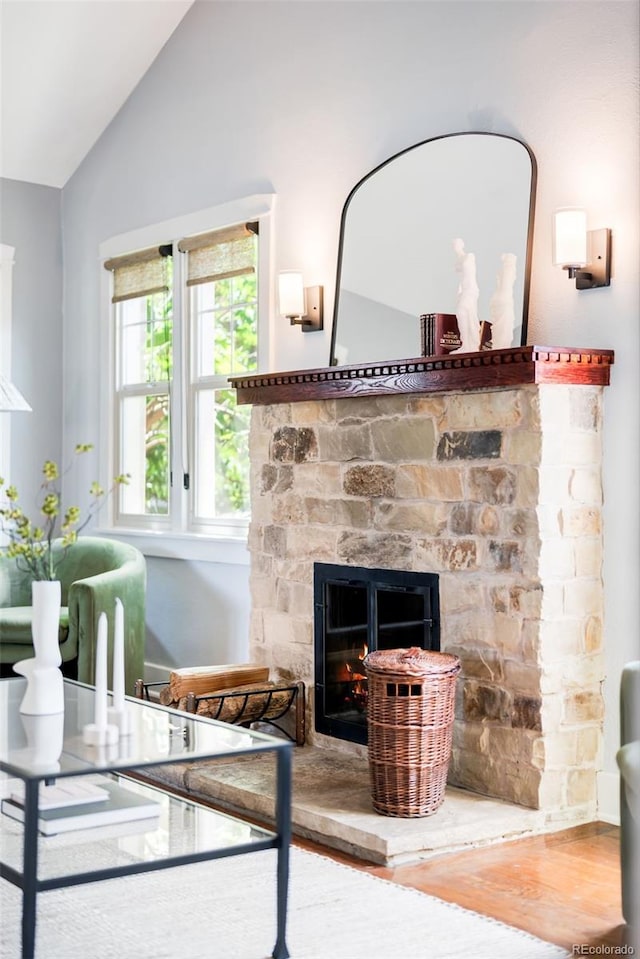 315 S Franklin St, Denver, CO 80209 - living area with wood finished floors, a fireplace, and vaulted ceiling