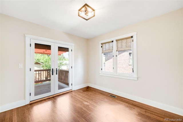 315 S Franklin St, Denver, CO 80209 - unfurnished room featuring wood finished floors, french doors, and baseboards