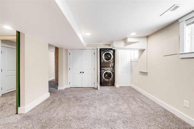 315 S Franklin St, Denver, CO 80209 - finished below grade area with stacked washer / drying machine, carpet floors, baseboards, and recessed lighting
