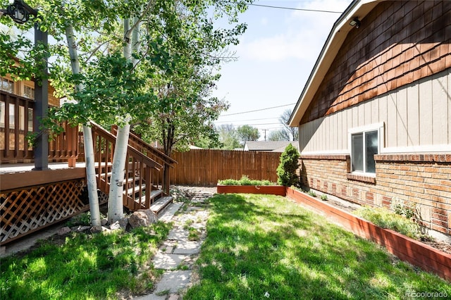 315 S Franklin St, Denver, CO 80209 - view of yard featuring a vegetable garden and a wooden deck