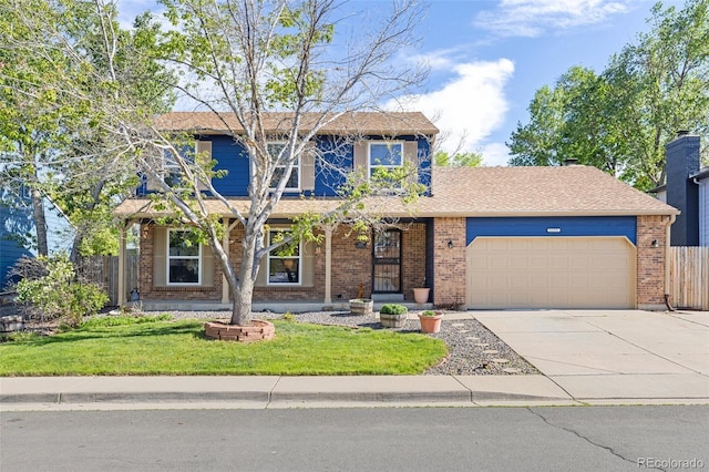 traditional home featuring an attached garage, driveway, and brick siding