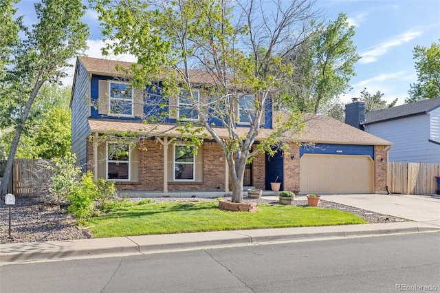 traditional-style home featuring an attached garage, driveway, and brick siding