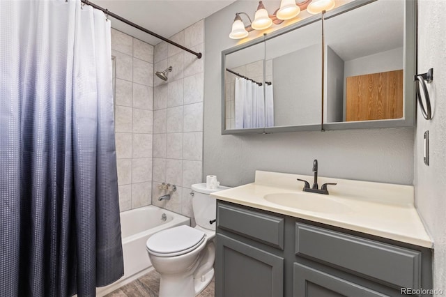 full bathroom with toilet, vanity, and shower / tub combo