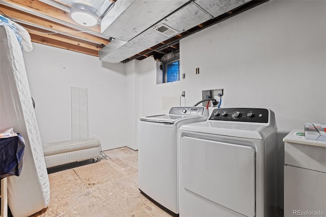 laundry area featuring washer and clothes dryer