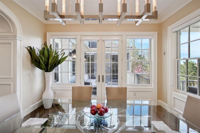 sunroom featuring french doors, beamed ceiling, coffered ceiling, and an inviting chandelier