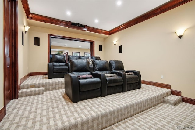 cinema room featuring light colored carpet and crown molding