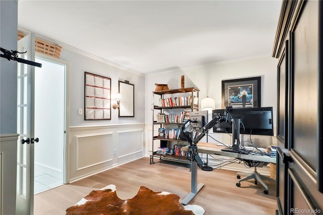 office space featuring ornamental molding and light hardwood / wood-style flooring