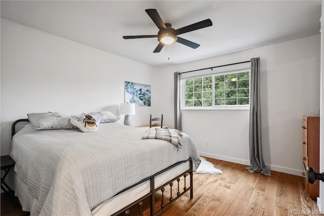 bedroom with ceiling fan and light wood-type flooring