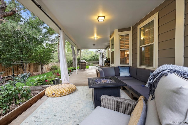 view of patio / terrace with a grill and an outdoor living space with a fire pit