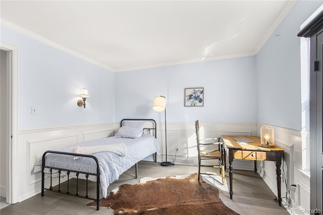 bedroom with hardwood / wood-style flooring and ornamental molding