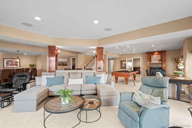 living room with billiards, light colored carpet, and decorative columns