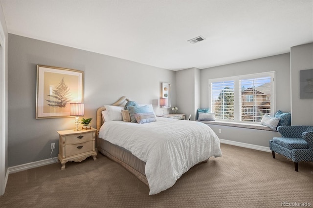 carpeted bedroom with baseboards and visible vents