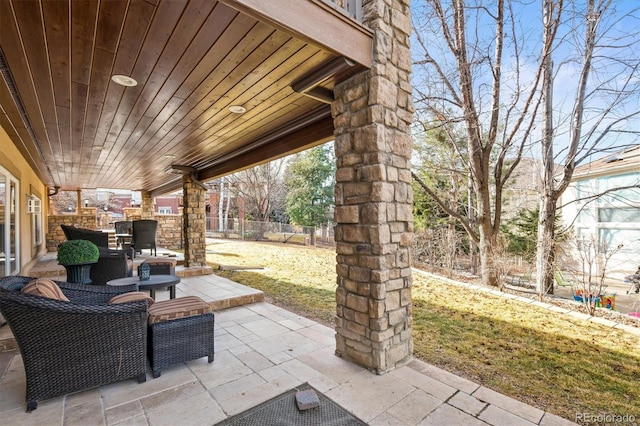 view of patio featuring fence