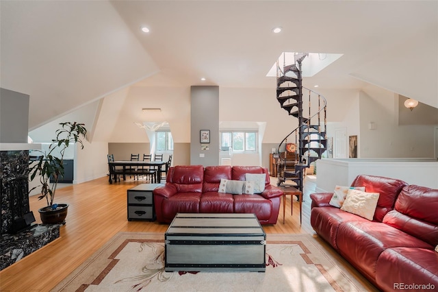 1165 N Pennsylvania St Unit 3B, Denver, CO 80203 - living room with stairway, light wood-style flooring, lofted ceiling, and recessed lighting