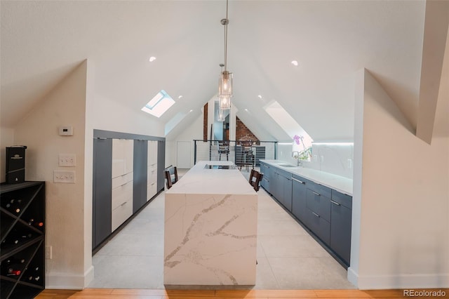 1165 N Pennsylvania St Unit 3B, Denver, CO 80203 - interior space with a skylight, a sink, lofted ceiling, pendant lighting, and baseboards