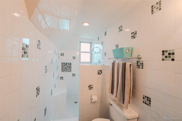 1165 N Pennsylvania St Unit 3B, Denver, CO 80203 - full bathroom with tile walls, a walk in shower, and toilet
