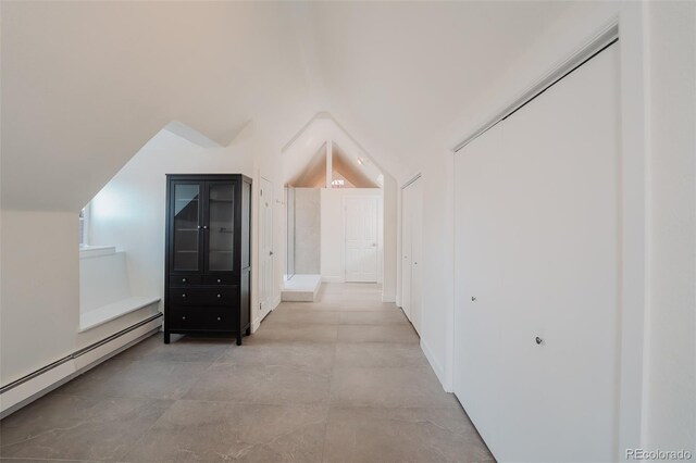 1165 N Pennsylvania St Unit 3B, Denver, CO 80203 - hall with a baseboard heating unit and lofted ceiling
