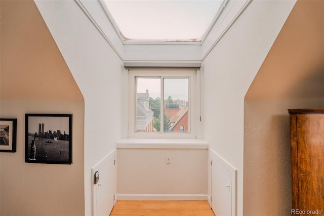 1165 N Pennsylvania St Unit 3B, Denver, CO 80203 - hallway featuring light wood finished floors and baseboards