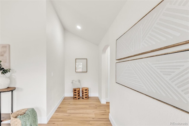 2600 S Downing St, Denver, CO 80210 - hallway featuring arched walkways, light wood finished floors, lofted ceiling, and recessed lighting
