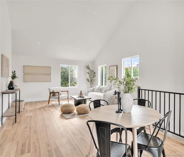 2600 S Downing St, Denver, CO 80210 - dining room featuring light wood-style flooring and high vaulted ceiling