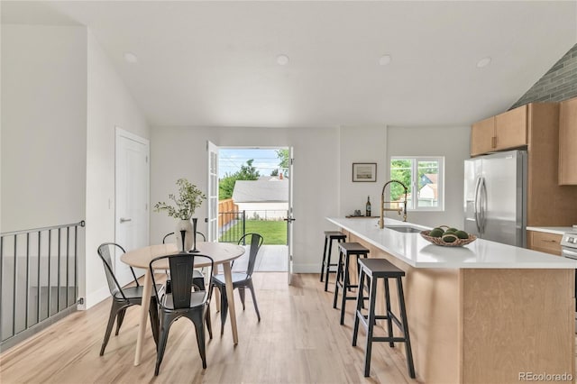 2600 S Downing St, Denver, CO 80210 - dining space featuring light wood finished floors and lofted ceiling
