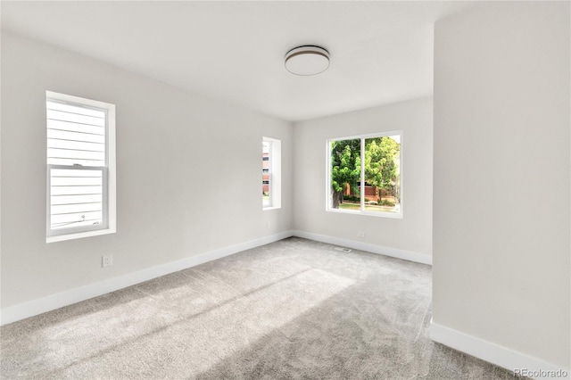 2600 S Downing St, Denver, CO 80210 - carpeted spare room featuring baseboards