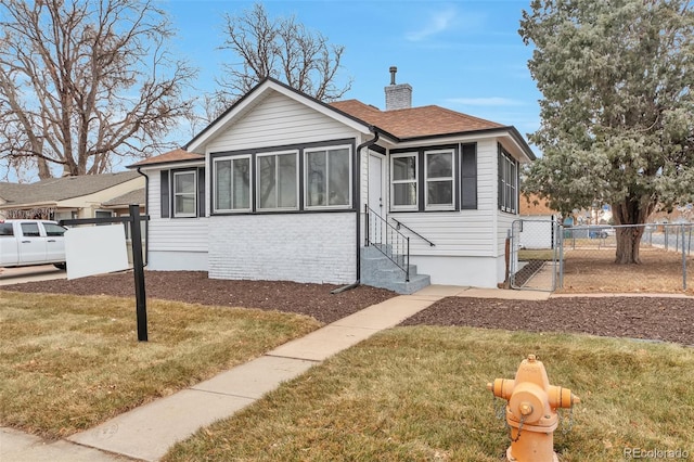 bungalow with a front yard