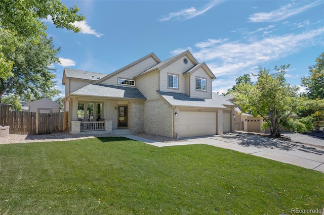 view of front of home with a front yard and a garage