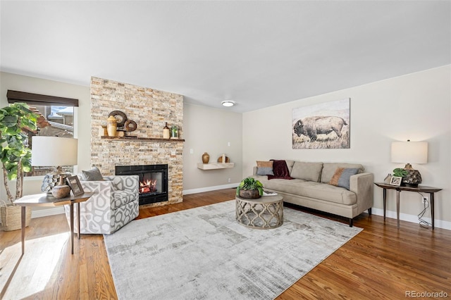 living room with hardwood / wood-style flooring and a fireplace