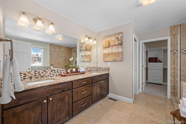 bathroom with vanity and backsplash