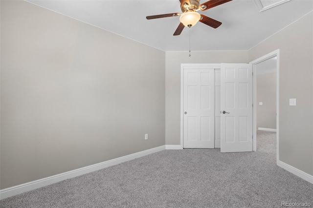 unfurnished bedroom with ceiling fan, a closet, and carpet floors