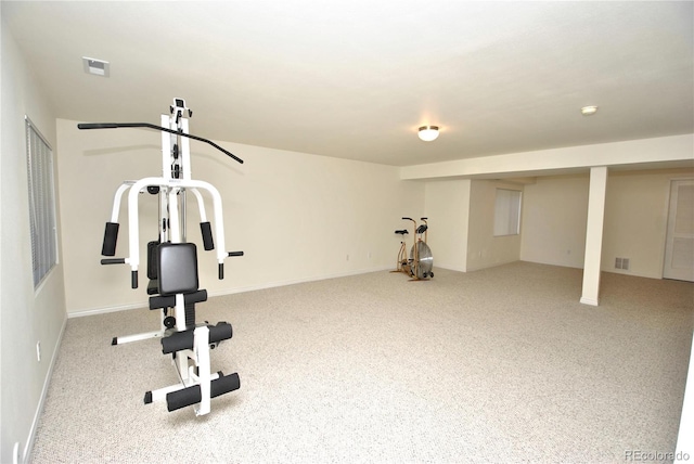 exercise room featuring carpet and visible vents