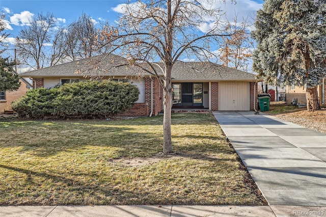 single story home with brick siding and a front yard