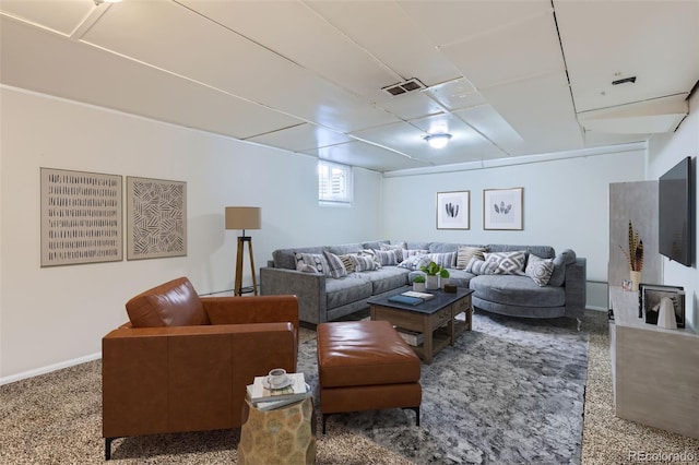 carpeted living area with visible vents and baseboards