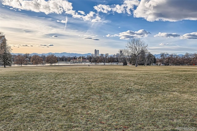 view of community featuring a yard and a mountain view