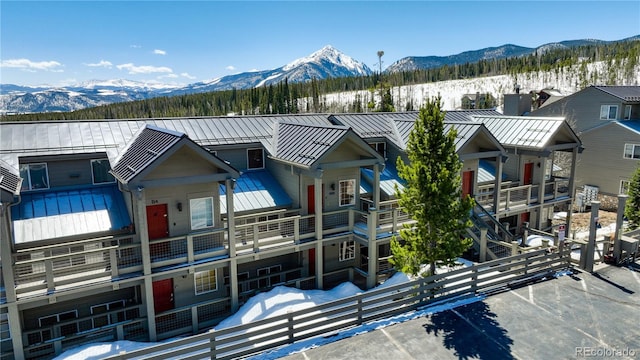 snow covered property featuring a mountain view