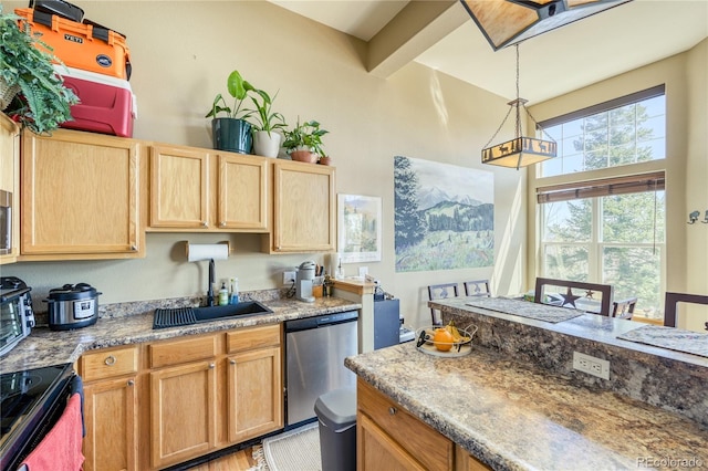 kitchen with light brown cabinets, hanging light fixtures, a sink, stainless steel appliances, and a high ceiling