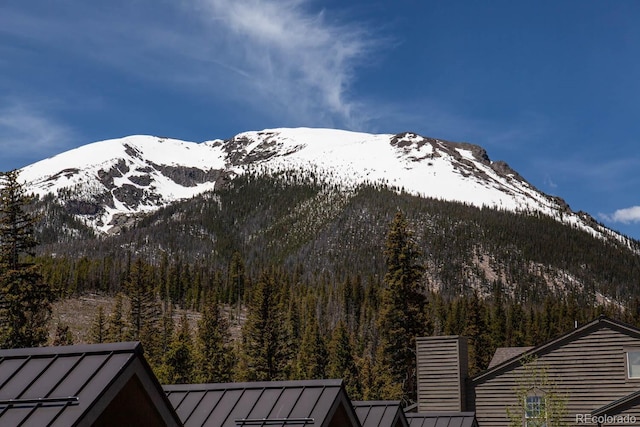 property view of mountains featuring a view of trees