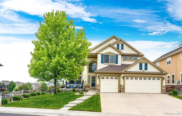22962 Briar Leaf Ave, Parker, CO 80138 - view of front of house featuring stucco siding, driveway, stone siding, and an attached garage
