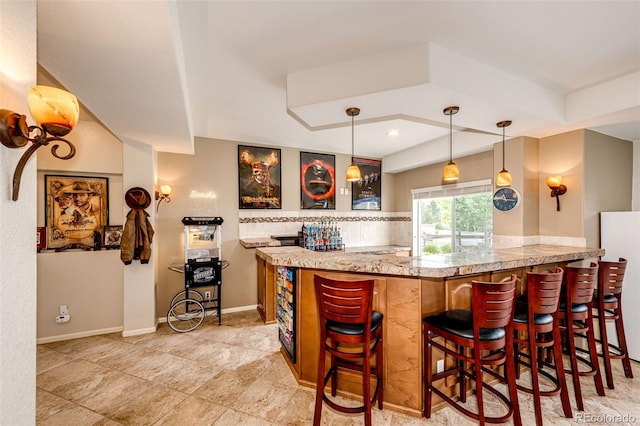 22962 Briar Leaf Ave, Parker, CO 80138 - indoor bar with hanging light fixtures, freestanding refrigerator, and recessed lighting