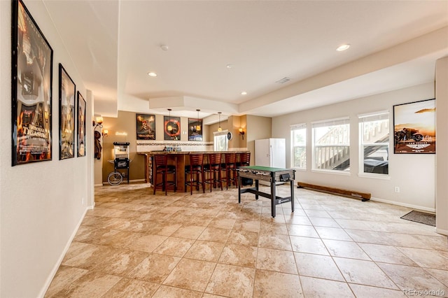 22962 Briar Leaf Ave, Parker, CO 80138 - dining room featuring bar with sink, baseboards, and recessed lighting