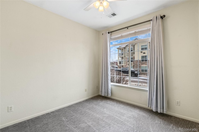 carpeted empty room with ceiling fan