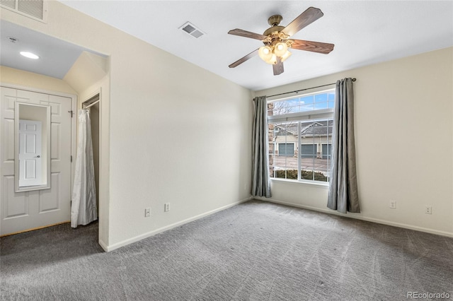 unfurnished room featuring ceiling fan and carpet flooring