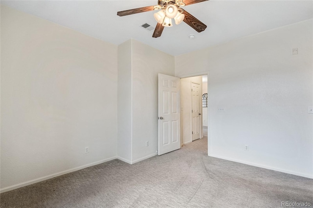 unfurnished room with ceiling fan and carpet flooring