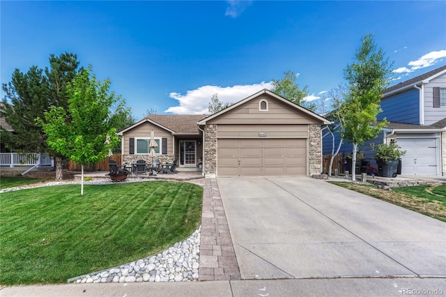 5402 S Queen Way, Littleton, CO 80127 - ranch-style house featuring a garage, driveway, and stone siding