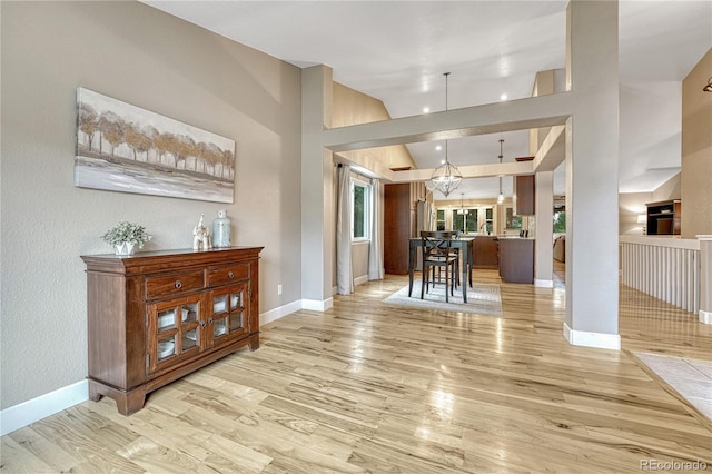 5402 S Queen Way, Littleton, CO 80127 - entrance foyer featuring light wood-type flooring and a chandelier